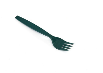 Green plastic forks on white