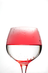 Wine glass with red smoke inside