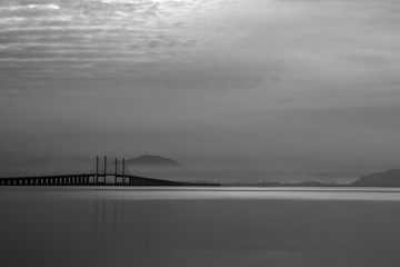 Fototapeta premium Silhouette of a distant hill in the early morning