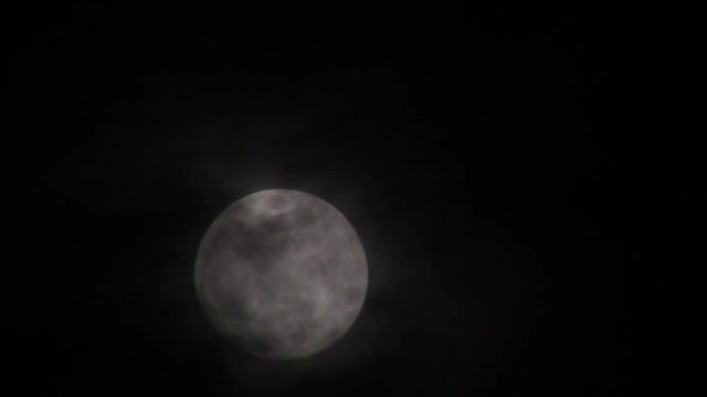 moon with passing dark clouds
