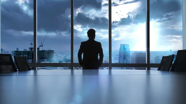 Executive looking at city for analyze something.