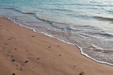  Natural clean sea sand and the wave are blowing  on the beach