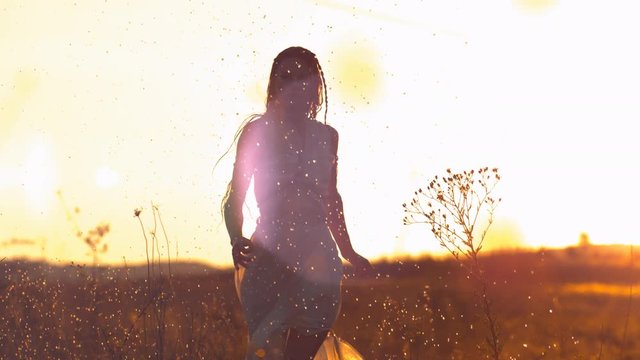 Woman with dress in the sunlight, slow motion