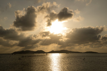 The sun fell into the water at the lake in the evening   