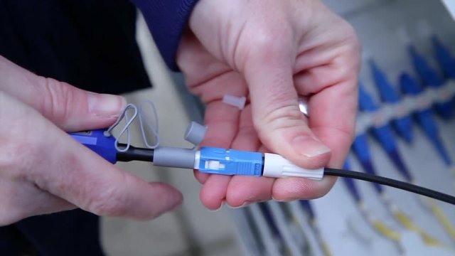 operator attaches fibre connector