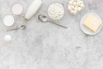 Fresh dairy products. Milk, cottage, cheese, yougurt on grey table top view