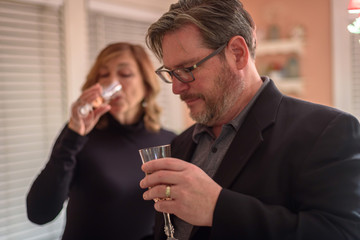 married couple at home getting ready to go out for anniversary dinner
