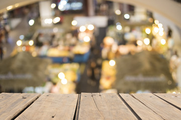 Wooden table on front blurred supermarket background, copy space
