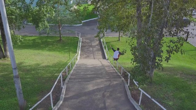 Aggressive inline roller blader grind on rail in skatepark outside. Clip. Summer extreme sport exercising outdoor in skate park. Various tricks