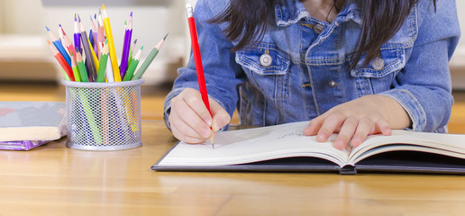 little girl writing paper, smiling cute child, Little girl painting in library, children education and development, copy space