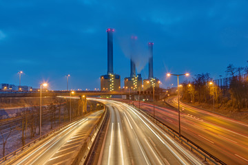 Fototapeta na wymiar Power station and highway at night seen in Berlin, Germany