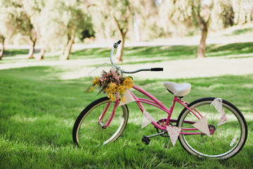 Pink bicycle with flowers
