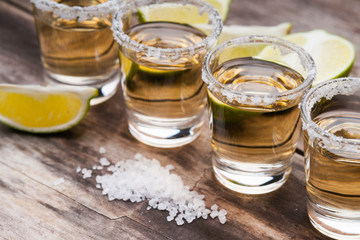 Tequila shots with lime fruits and salt 