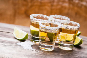 Tequila shots with lime fruits and salt 