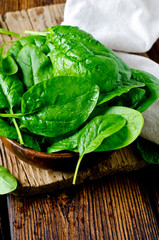 Fresh spinach on a cutting wooden board