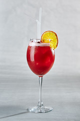Red Cocktail with Berries and Orange