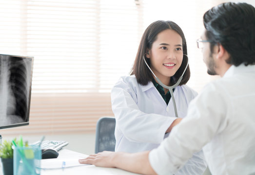Doctors are using a stethoscope to check lungs and heart.