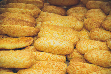 lot of bread close up on the shelf of store