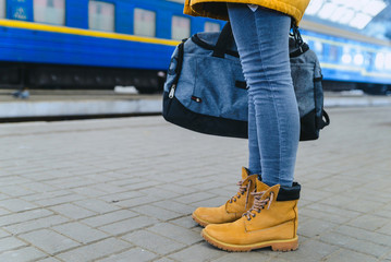 woman take bag at railway station.