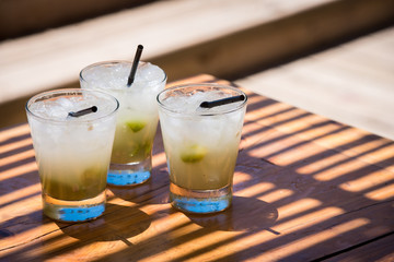 Three cold delicious caipirinhas ready to drink