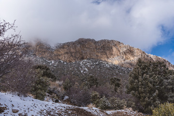 Fototapeta na wymiar Low angle view of snowy rocky mountain