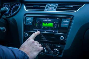 infotainment system showing green score and petrol consumption