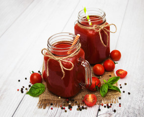 Jars with tomato juice