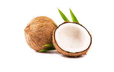 Fototapeta na wymiar Coconut with half andgreen leaves on white background.