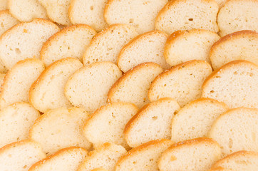 White toasts with ruddy crust closeup as background, top view. Fast food backdrop.