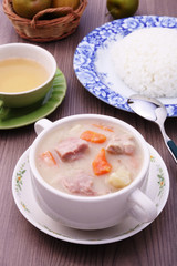 A bowl of creamy pork stew. 