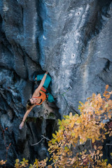 Blonde girl climbs tufa rock, Chitdibi, Turkey