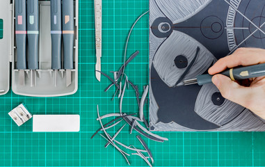 Lino cutting tools on a desktop.