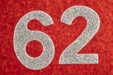 Number sixty-two silver color over a red background. Anniversary