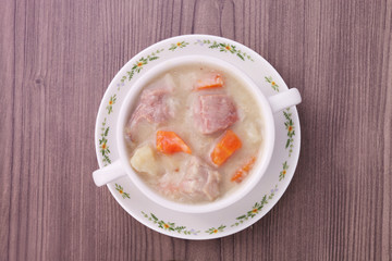 A bowl of creamy pork stew. 