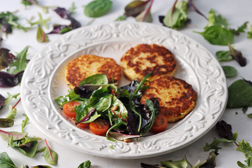 pancakes with potato salad in a bowl