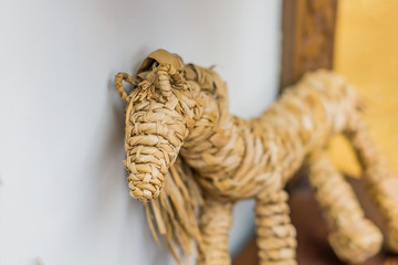 a horse made of straw, selective focus