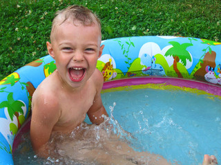 Kid in summer little pool © km