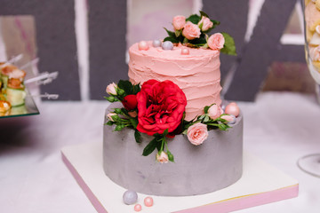 Wedding cake with a red poppy flower