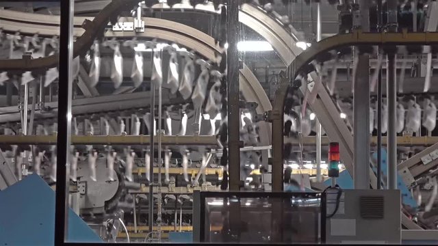 Newspaper production lines seen through a window