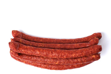 Thin smoked sausages isolated on a white background