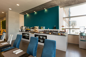 Hotel breakfast, buffet table, restaurant interior