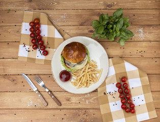 Fresh burger closeup on wooden table.