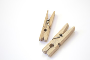 Wooden clothespin on a white background