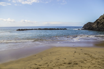 Fototapeta na wymiar Canary Islands. Beautiful beaches on a sunny day on the island of Tenerife. Shores of the atlantic ocean.