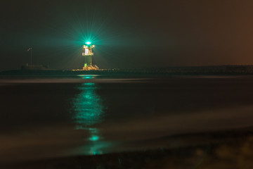 Long exposure in the port of Warnem&uuml;nde at the green lighthouse. Concept: maritime or vacation and travel
