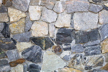 Fence of ornamental stone, ray background stylized in a natural wild stone
