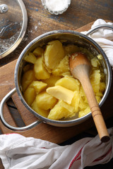 Hot potato with butter in pot