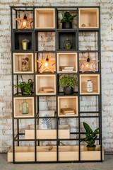 Brick wall home bookshelf with lamp. Interiror in the loft style