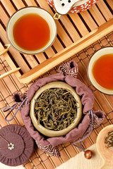 Tea caddy and Chinese tea set on wooden table