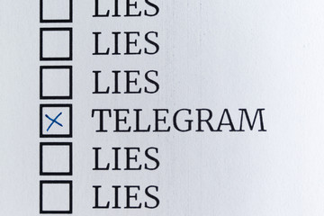 Questionnaire. Blue pen ink and the inscription "TELEGRAM" with cross on the white paper